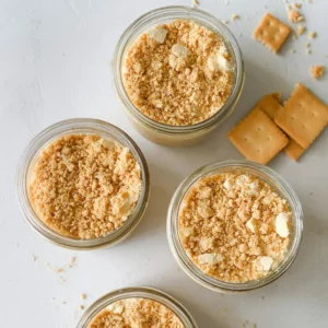 Tiramisu chia pudding jars topped with crushed graham crackers